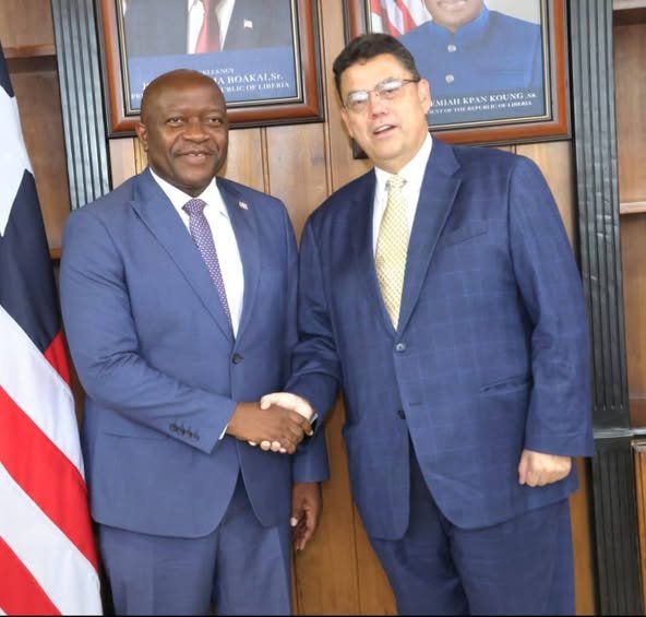 Minster Ngafuan (left) in a handshake with Mr. Zadrozny