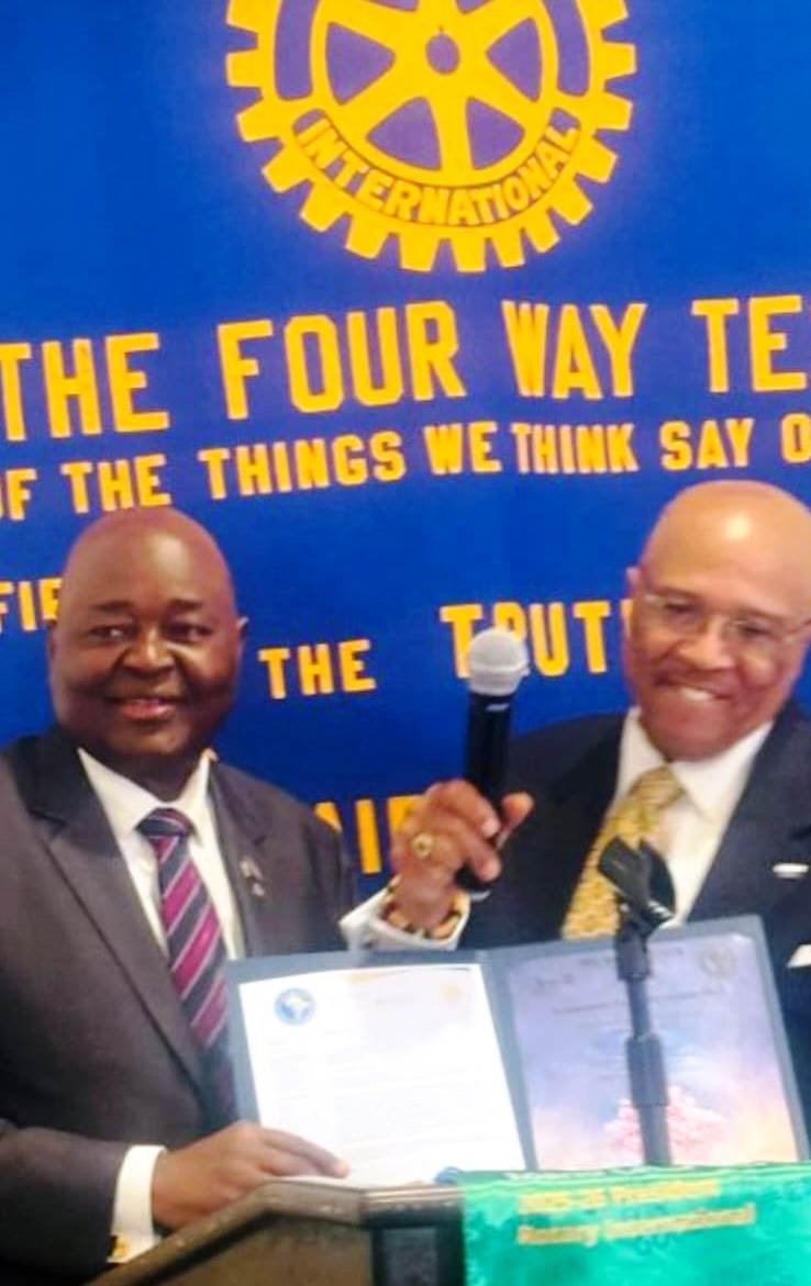 Amb. Conteh (left) receives honor at the event in Washington