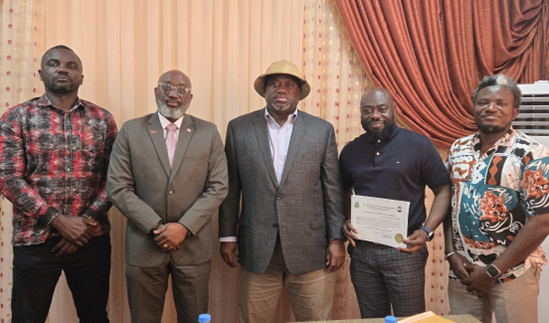 Members of the Board of Commissioners, Hon. Charles Umehai and Mr. Mark McCauley, recipient of the first solar PV installer license