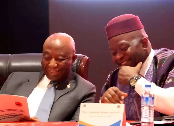 President Joseph N. Boakai (left) in a chat with Finance and Development Planning Minister Augustine K. Ngafuan